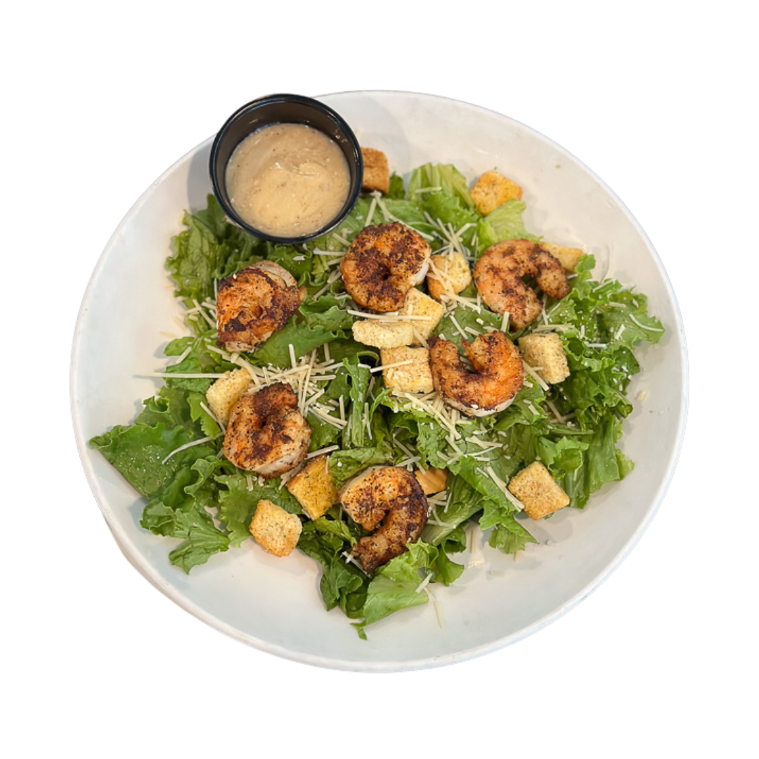 A shrimp caesar salad plate, a menu item at Rum Bay Palm Island.